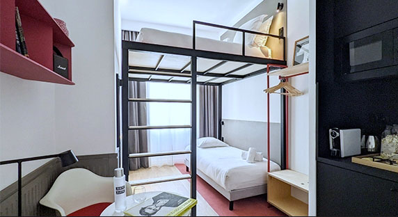 Modern, spacious and bright hotel room for three persons with a bunk bed and a kitchen